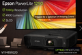 Epson PowerLite 1290 projector with a colorful display and office setting.